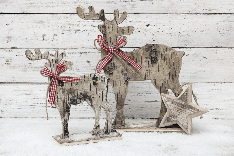 Christmas Reindeer on wooden background in scandinavian style