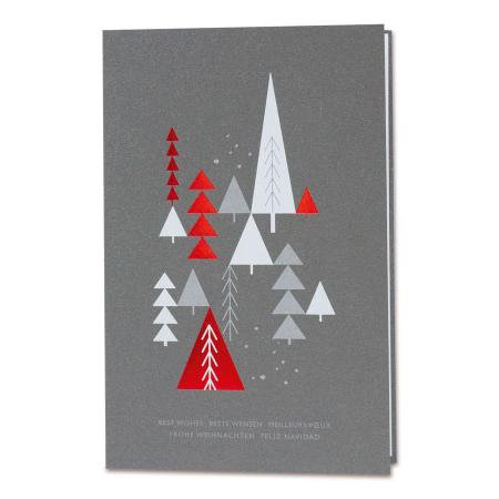 Donkergrijze kerstkaart met rode en witte kerstbomen